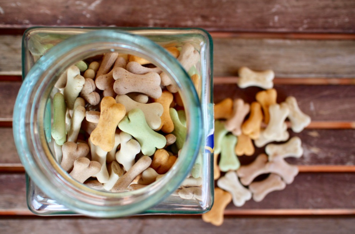 A glass jar filled with cookies is easy for a dog to tip over and break. Then, the dog may ingest shards of glass along with the cookies.